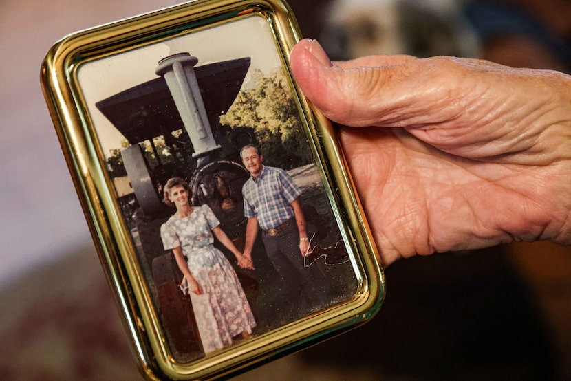 Bonnie Gayler holds an old photo of herself and her husband, Lester.