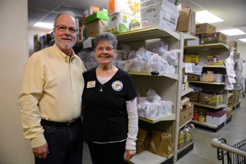 CEO Larry Horner and pantry director Gene Sims  stand in front of the shelves at the Cedar...