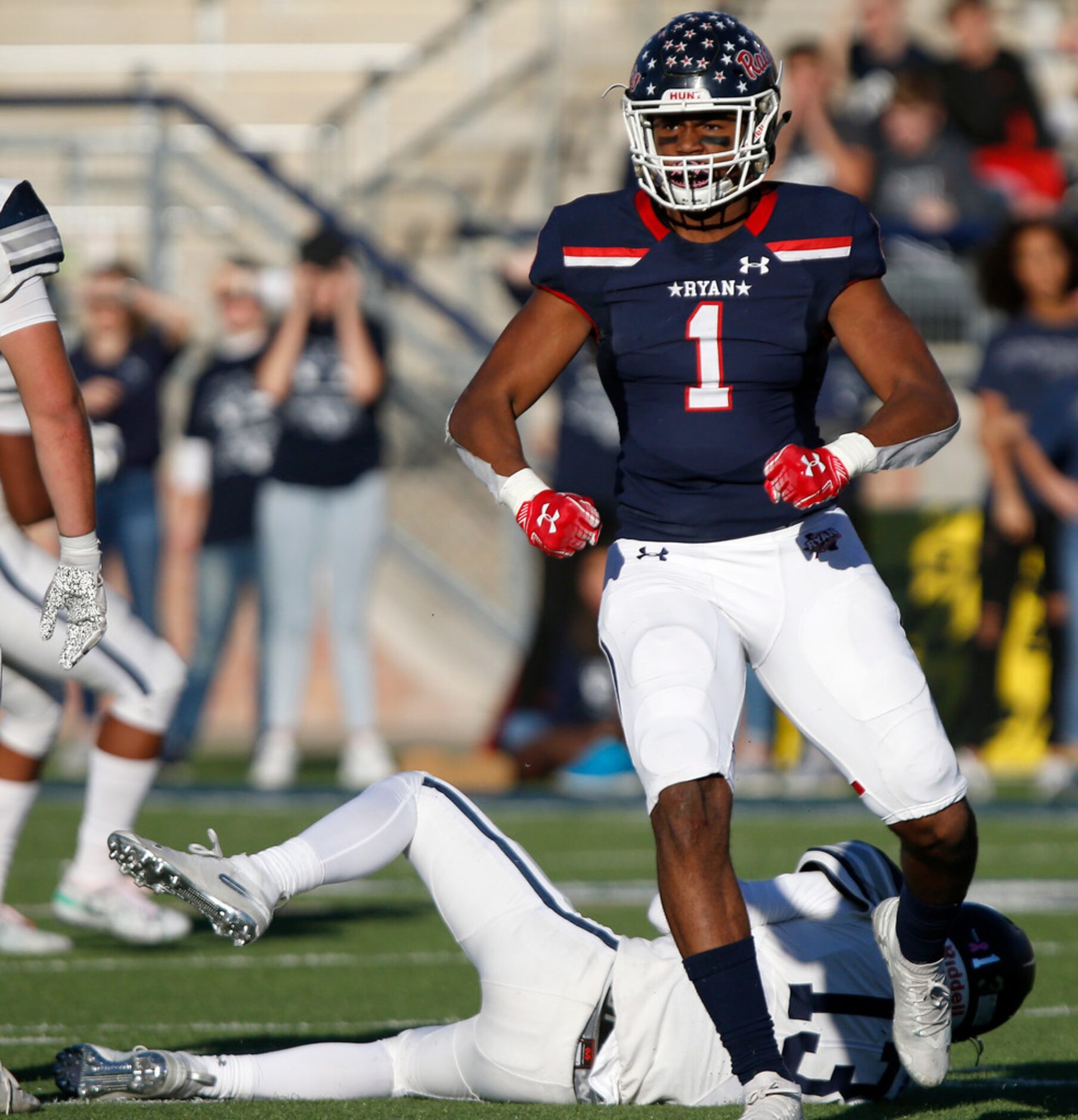 Denton Ryan High School defensive end Ja'tavion Sanders (1) celebrates a sack during the...