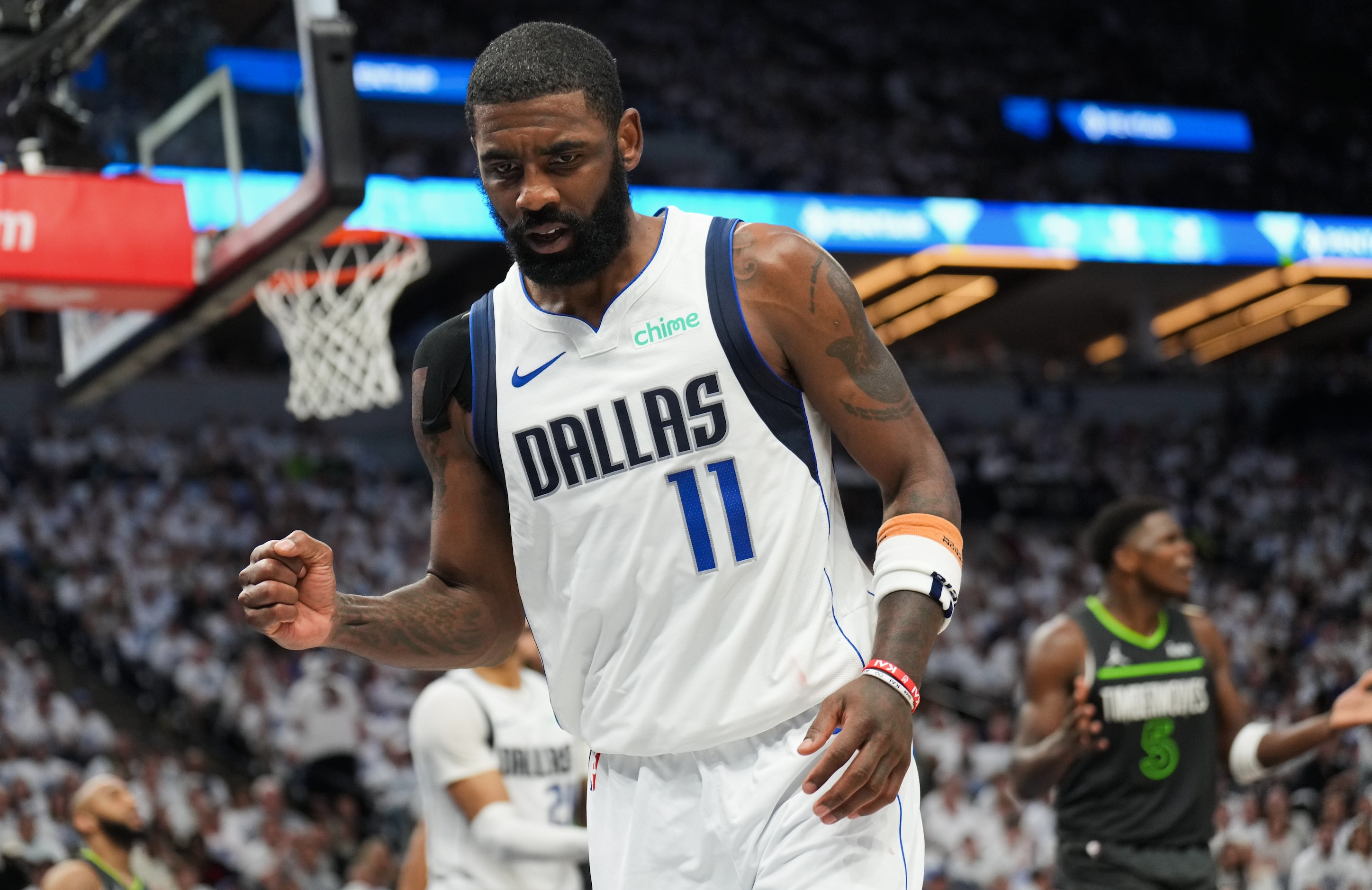 Dallas Mavericks guard Kyrie Irving (11) celebrates after being fouled on a drives to the...