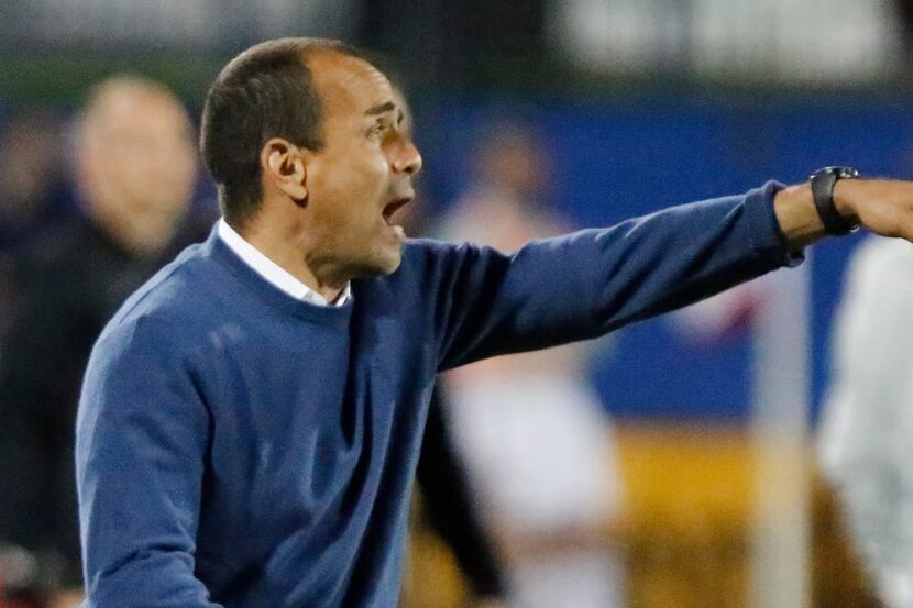 FC Dallas head coach Oscar Pareja gives instruction to players on the field during the...