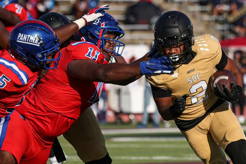 Duncanville High School Elijah Wilson (5) and Micheal January (11) reach for South Oak Cliff...