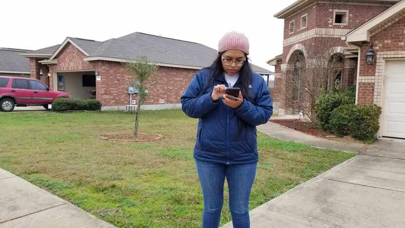 Congressional candidate Jessica Cisneros checks for the next home on her list as she...