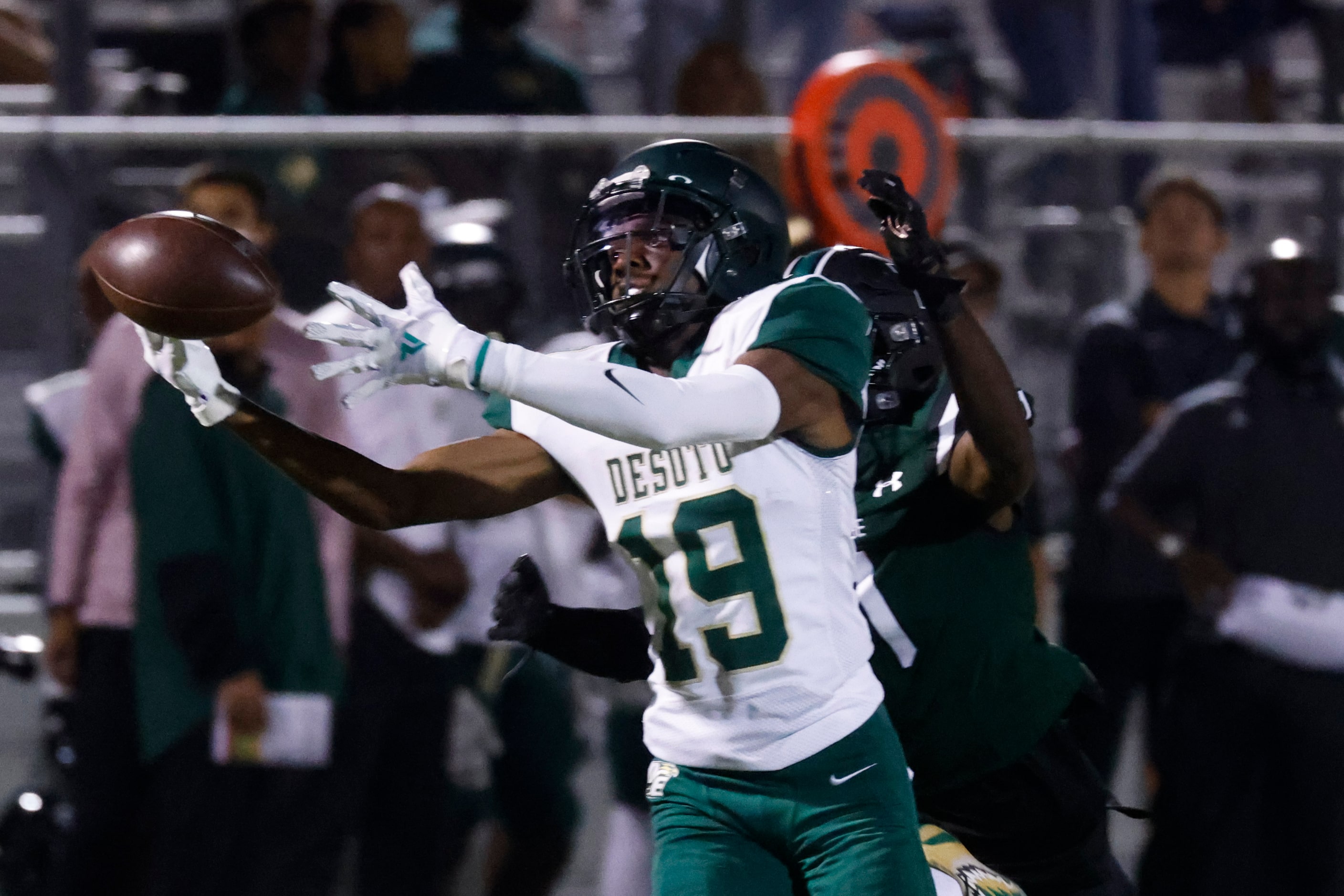 DeSoto High School’s Jordyn Collins (19) misses to receive a pass against Lake Ridge High...