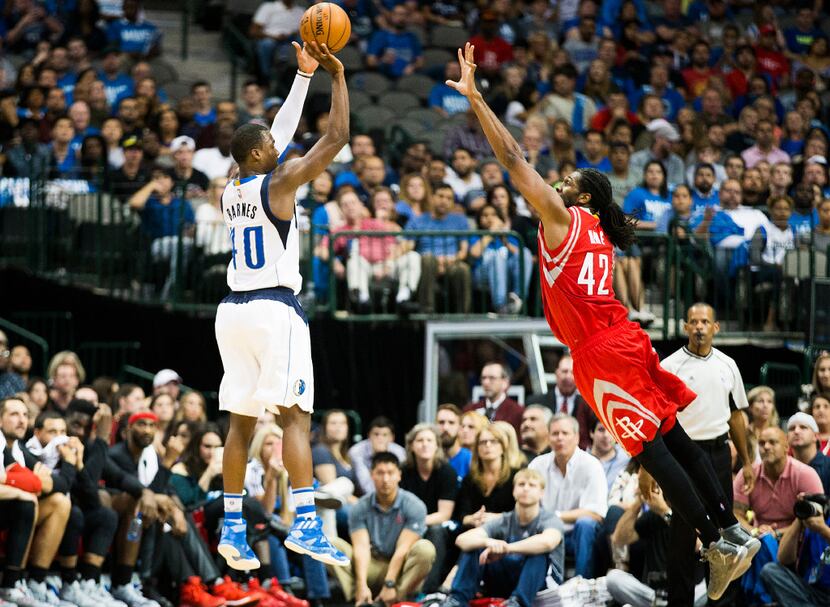 Dallas Mavericks forward Harrison Barnes (40) shoots a 3-pointer over Houston Rockets center...