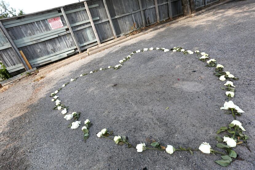 A memorial made from a garland of roses marks the spot where Sara Hudson's body was found in...