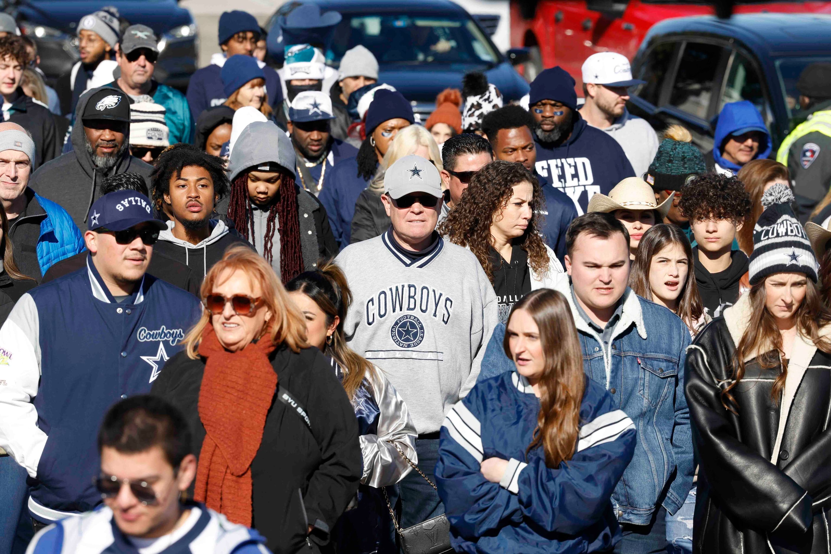 Fans make their way towards AT&T Stadium ahead of a NFL game between Dallas Cowboys and...