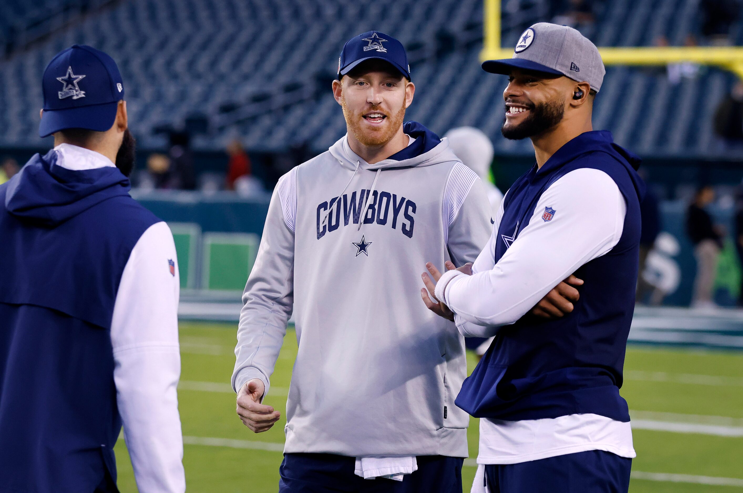 Dallas Cowboys quarterbacks Will Grier (left) Cooper Rush (center) and Dak Prescott visit...