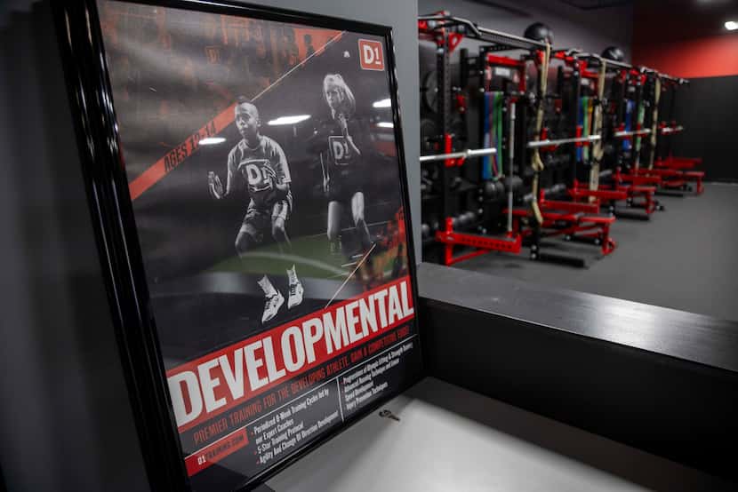 A sign advertising developmental training for youth ages 12-14 and fitness equipment at D1...