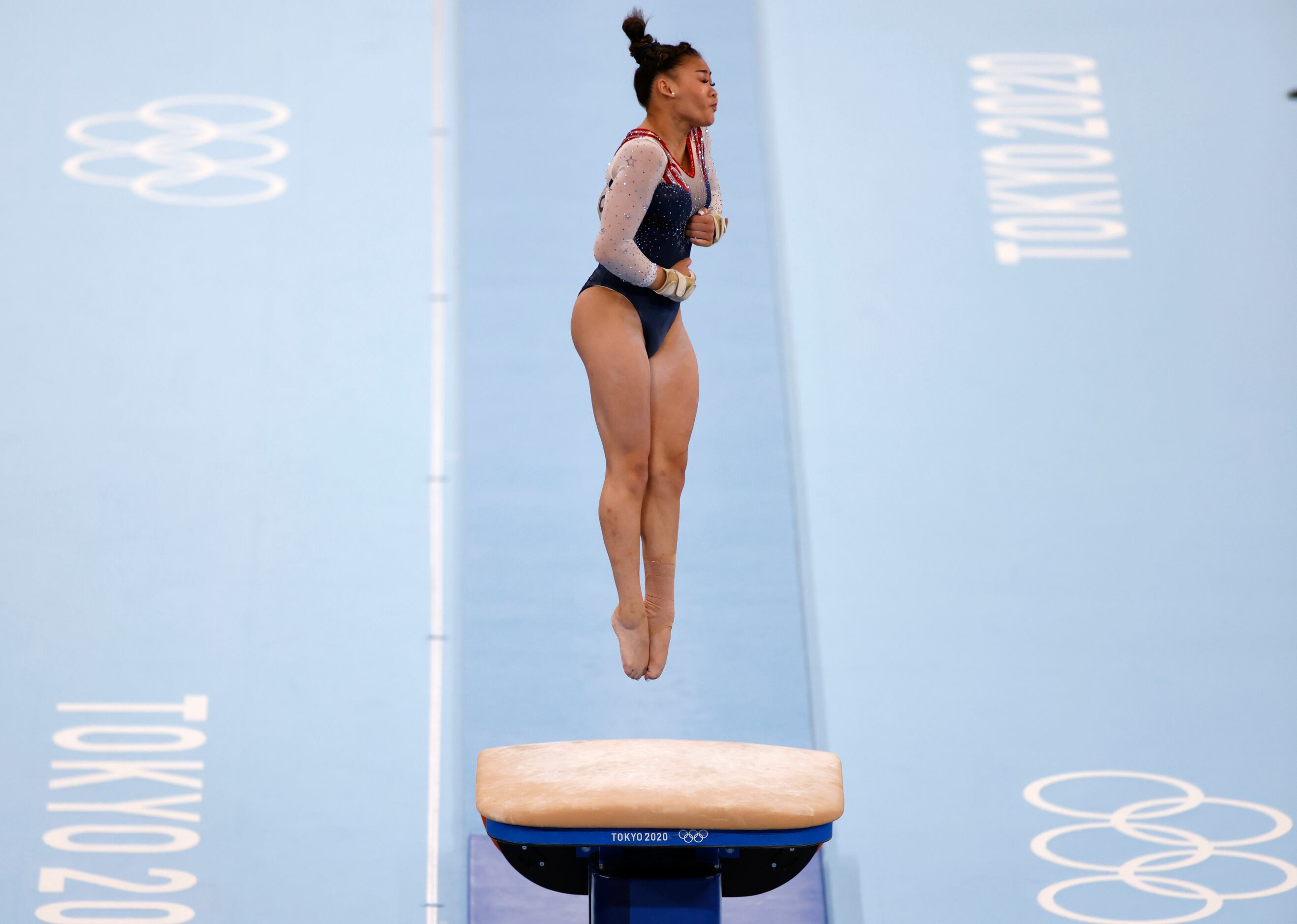 USA’s Sunisa Lee competes on the vault during the women’s all-around final at the postponed...