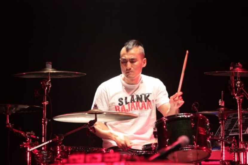 
Korean band drummer Kim Jin Won prepares his drum set before the band plays a show at the...