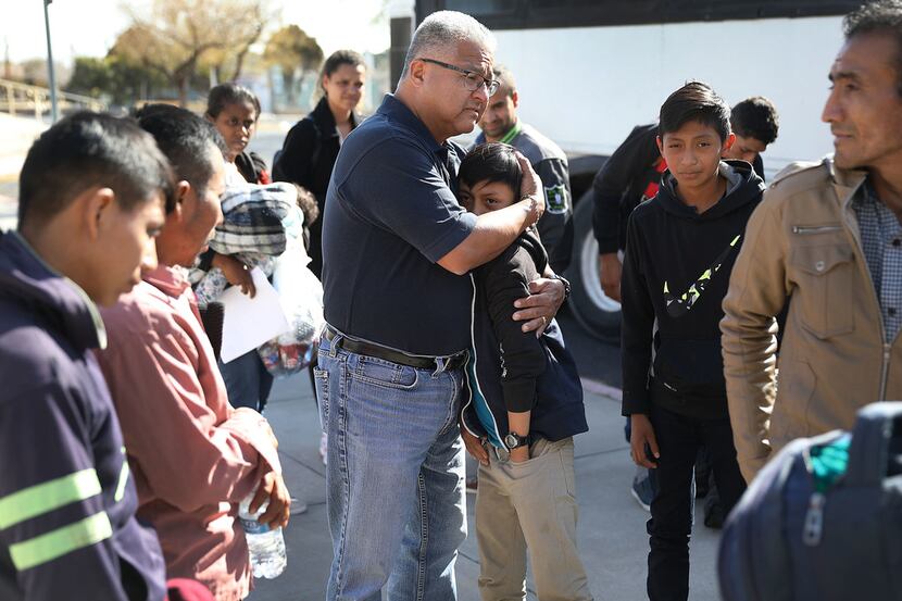 Roberto Diaz welcomes migrants to an Annunciation House facility after they are released by...