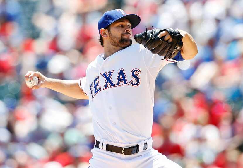 Texas Rangers starting pitcher Nick Martinez (22) throws during the first inning against the...