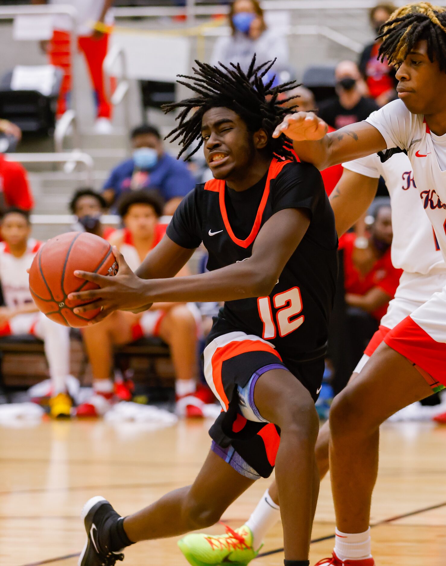 Lancaster's Jarod Johnson (12) attempts to drive past Kimball's defense during the first...