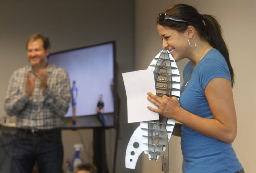 Calvin Carter, CEO of Bottle Rocket Apps, applauds as Shelby Juilfs receives the Steely-Eyed...