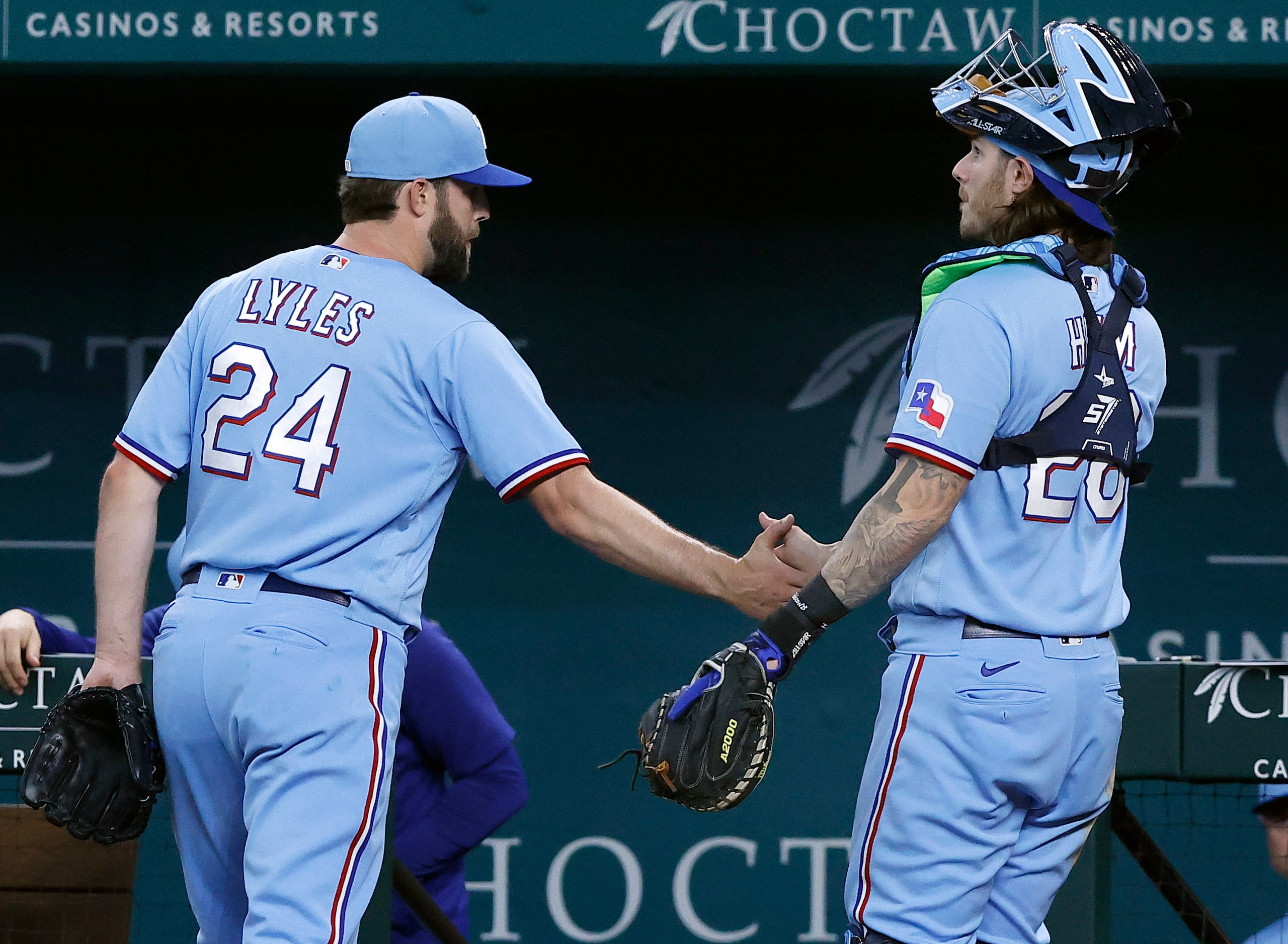 Texas Rangers starting pitcher Jordan Lyles (24) is congratulated by catcher Jonah Heim...