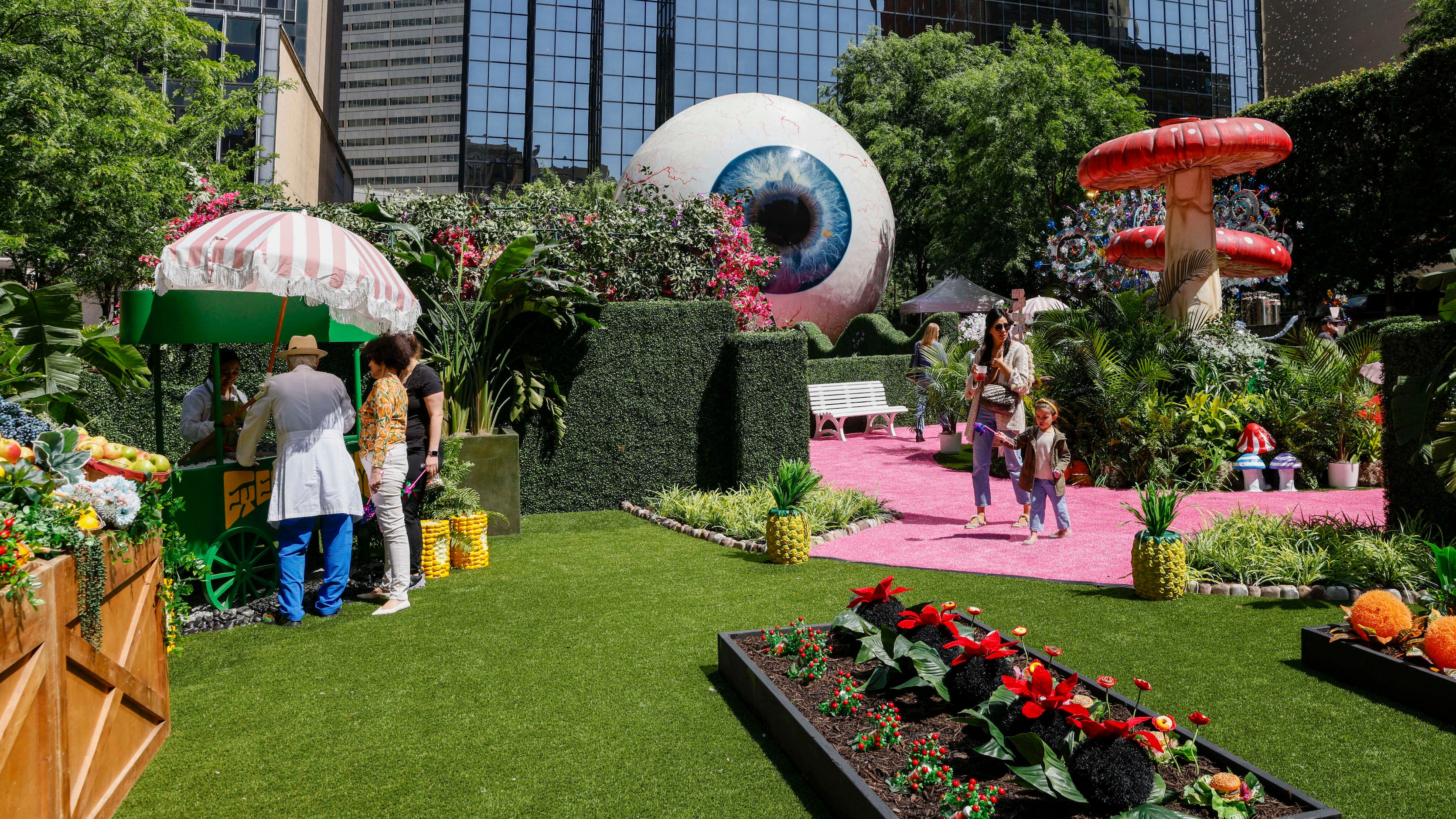 People check out the Eyeboretum at The Eye at the Joule on Friday.