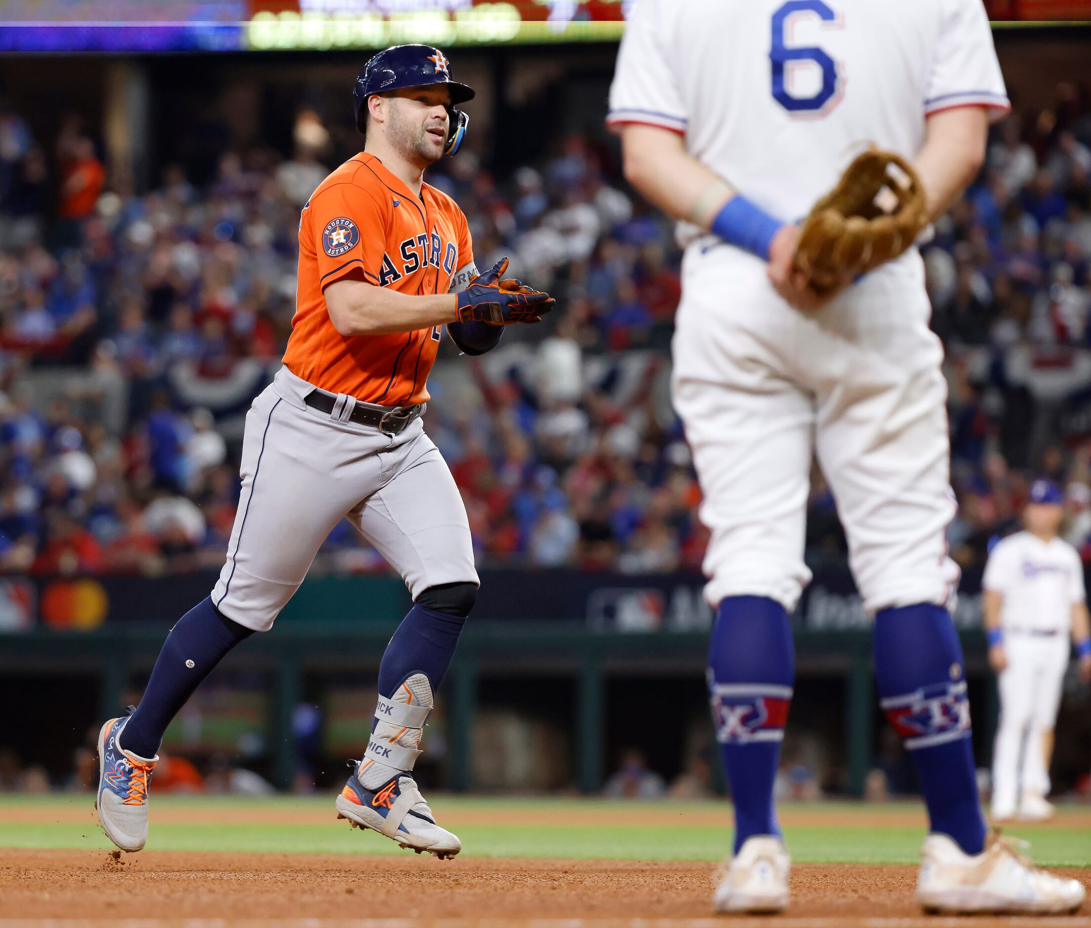 Houston Astros left fielder Chas McCormick (20) claps to the dugout as he rounds the bases...