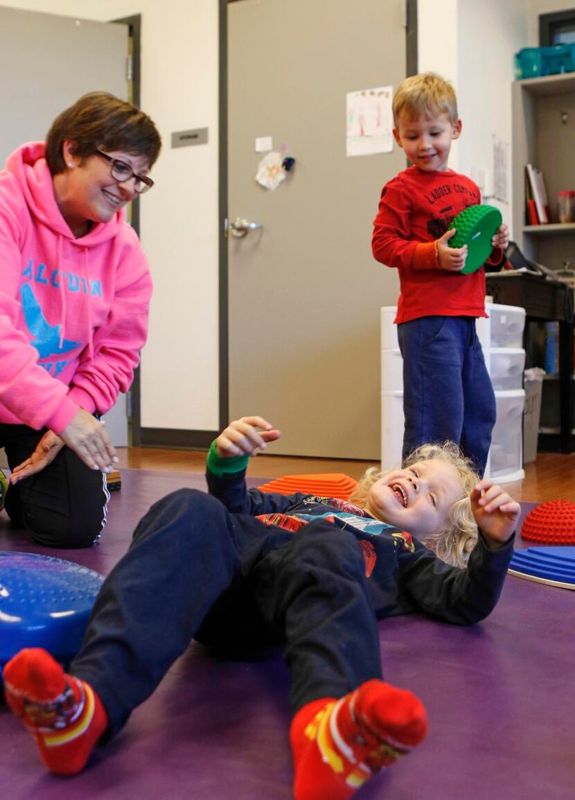 
Physical education teacher Tracy Cossey (left) works with primary school student Jack Dyer....