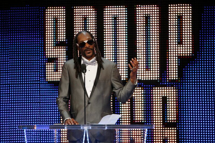 Celebrity inductee Snoop Dogg speaks during the WWE Hall of Fame event at American Airlines...