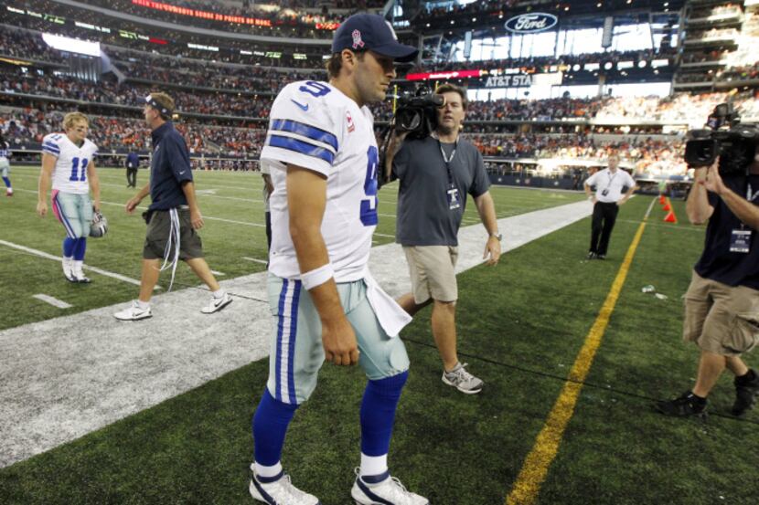 Dallas Cowboys quarterback Tony Romo (9) leaves the field after they lost to the Denver...