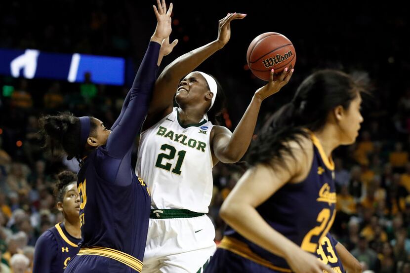 California center CJ West (30) defends as Baylor center Kalani Brown (21) goes up to shoot...