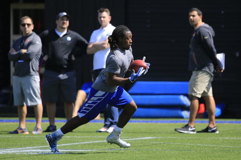 UCLA running back Paul Perkins takes part in the schoo'sl annual NFL football pro day, in...