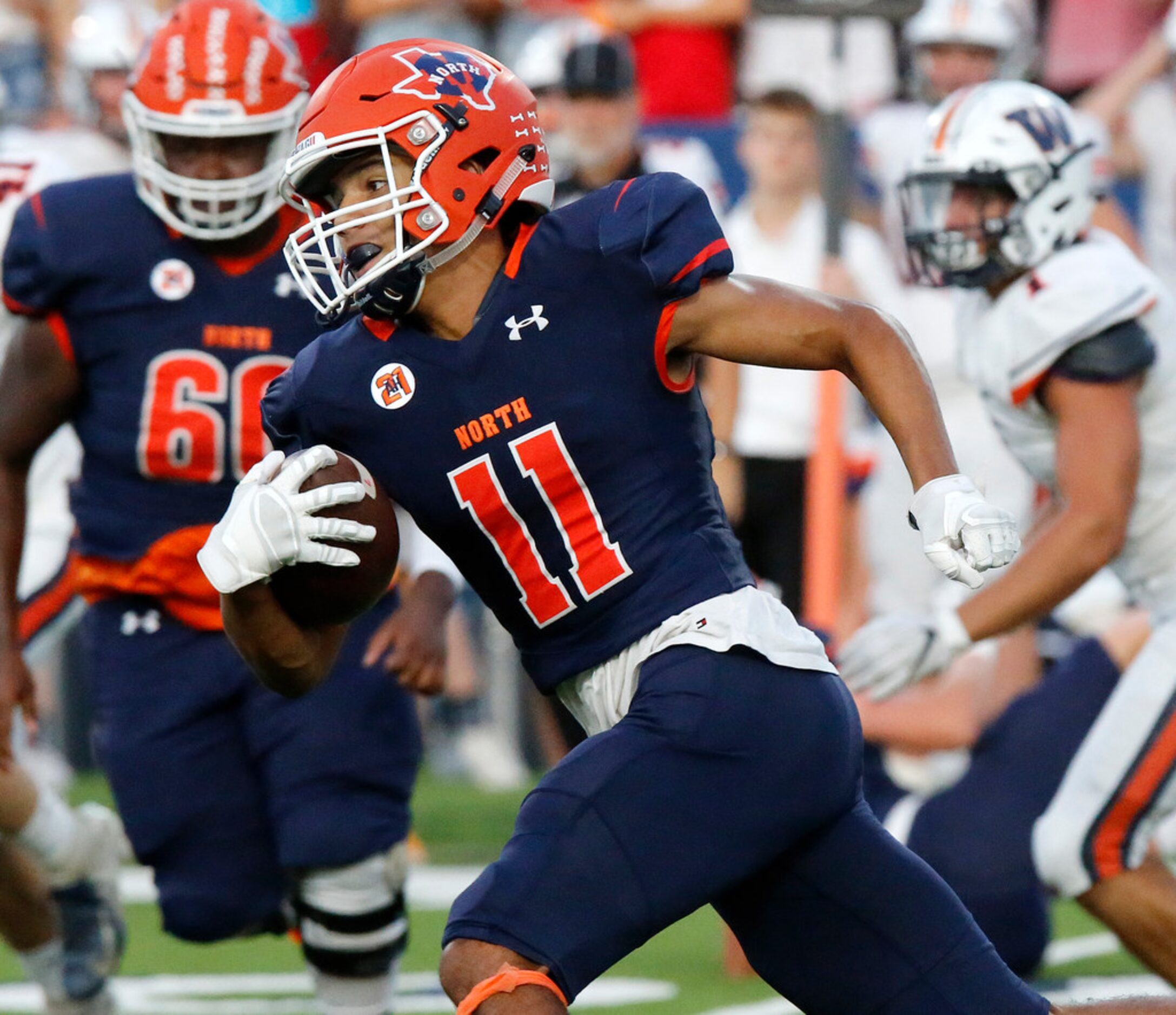 McKinney North High School wide receiver Noah Ford (11) runs after the catch during the...