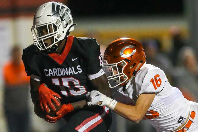 Melissa wide receiver Antonio Robinson (10) hauls in a pass to score a touchdown past Celina...