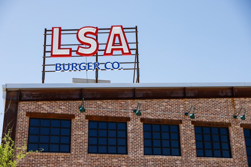 The LSA Burger Co. in The Colony is a brand-new building near a man-made pond in the...