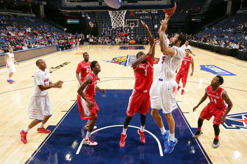 MEMPHIS, TN - MARCH 13: Cannen Cunningham #15 of the SMU Mustangs shoots against Mikhail...
