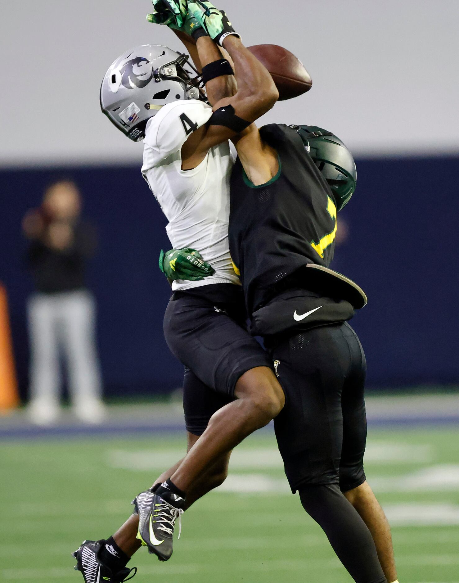 DeSoto defensive back Jamarion Ravenell (7) breaks up a first half pass intended for Denton...