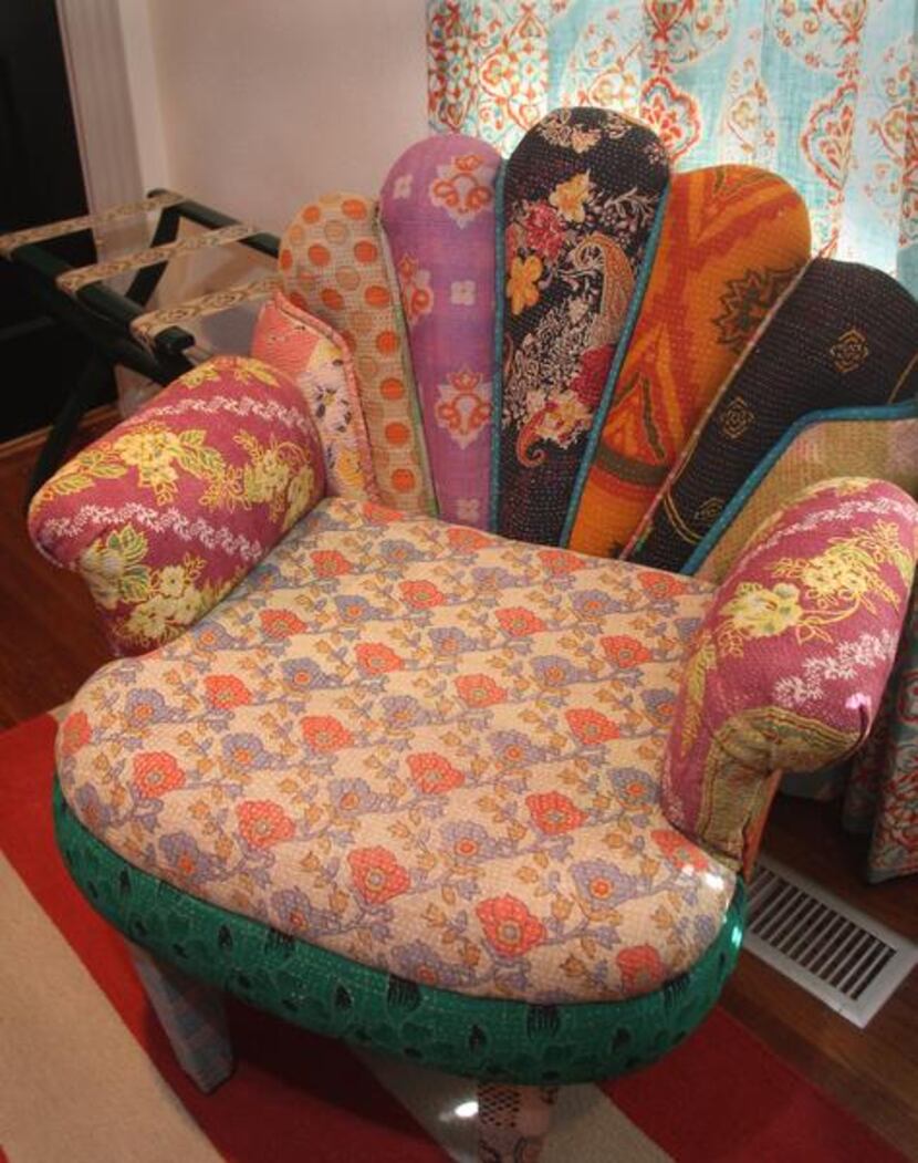 
A chair upholstered in various textiles made in India sits in the guest bedroom.
