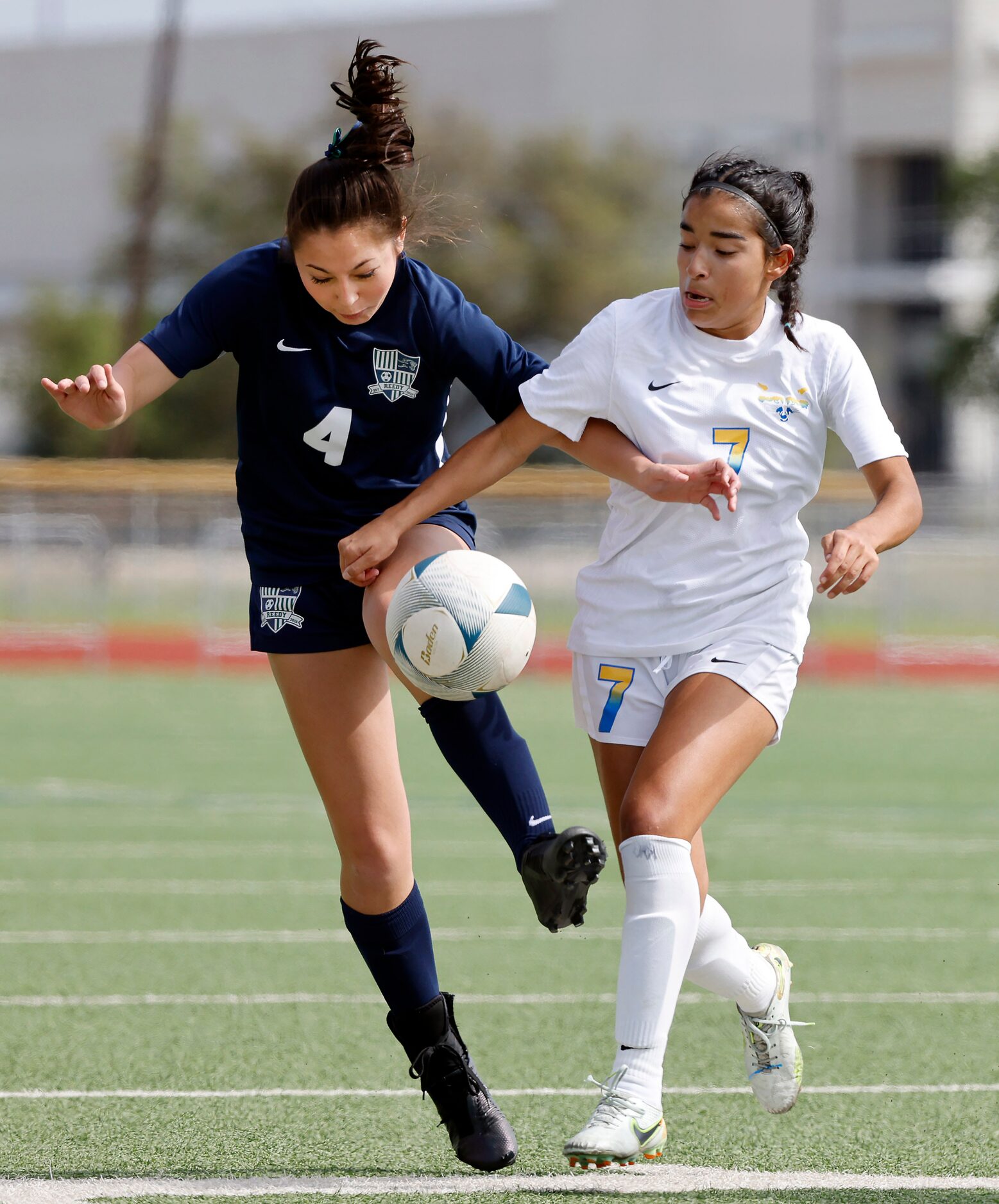 Frisco’s Luci Rodriguez (7) battles Frisco Reedy’s Naia Rentschler (4) for control of the...