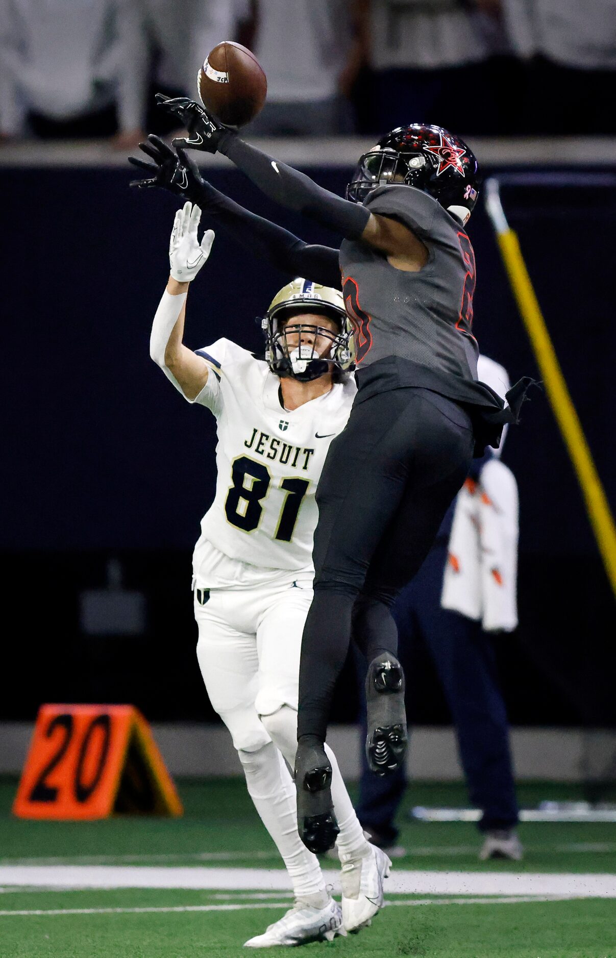 Coppell cornerback Seth Carethers (20) deflects a pass intended for Jesuit wide receiver...