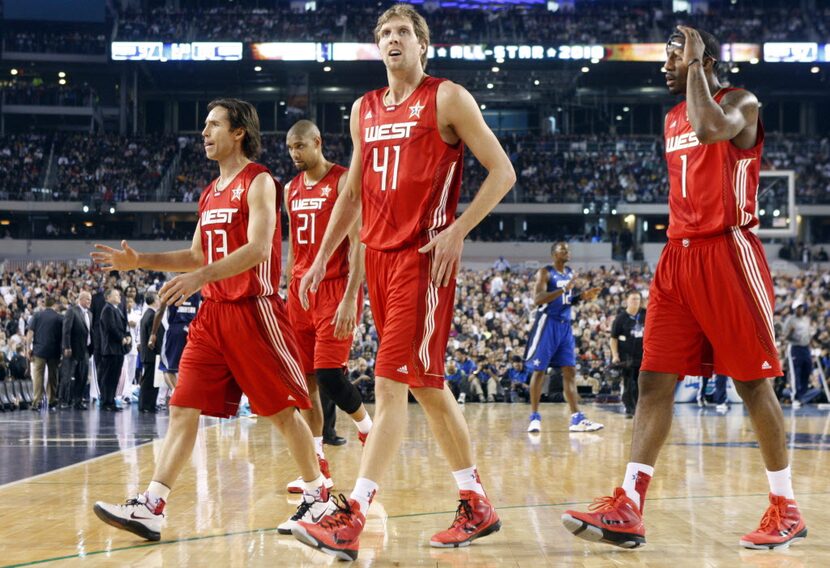 Steve Nash, Tim Duncan, Dirk Nowitzki and Amar'e Stoudemire head to the sideline during a...