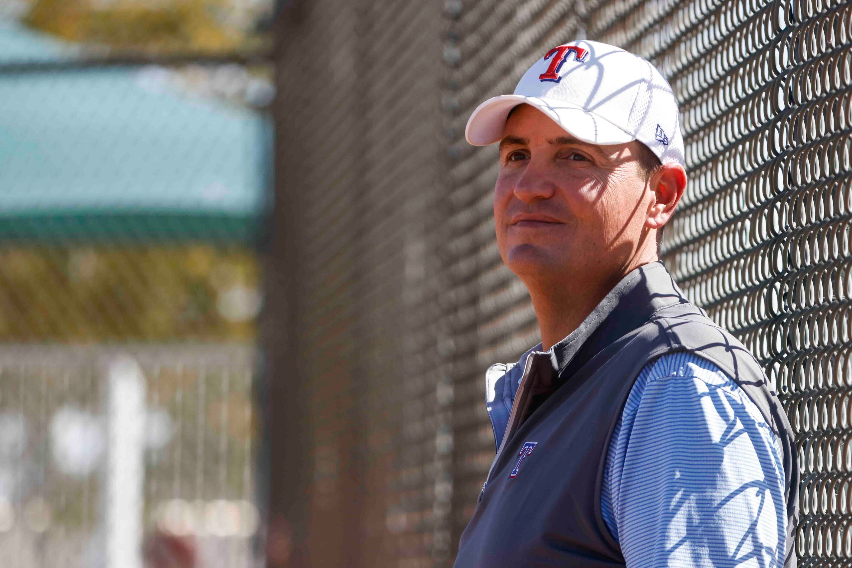 Texas Rangers general manager Chris Young observes a batting practice during a spring...