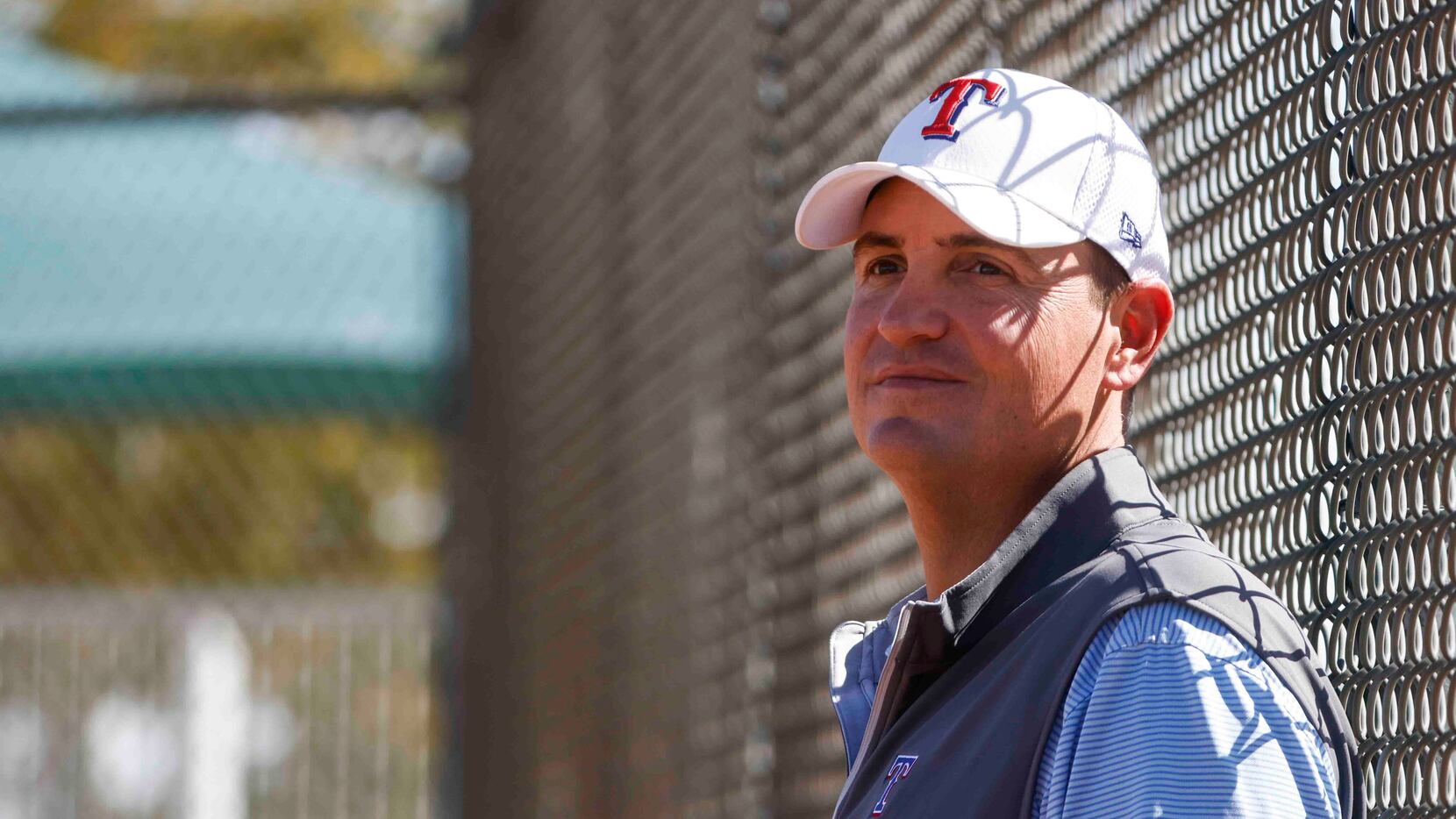 Texas Rangers general manager Chris Young observes a batting practice during a spring...