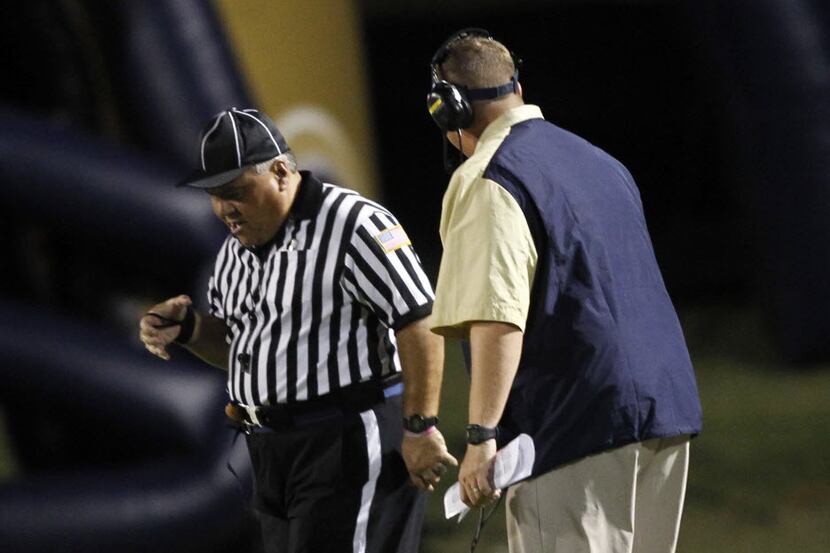 Jesuit head coach Brandon Hickman argues with an official after Berkner quarterback Calvin...