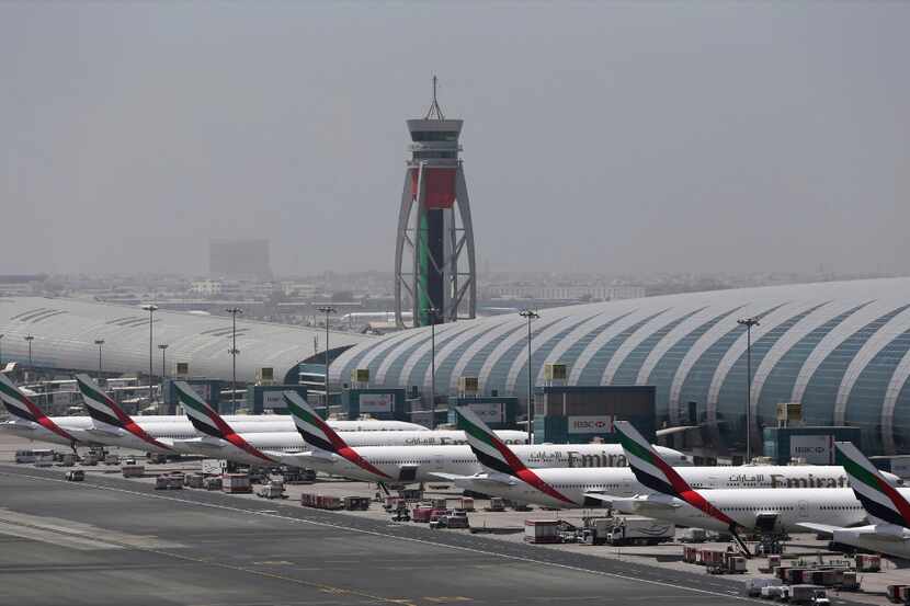 Emirates planes are parked at the Dubai International Airport in Dubai, United Arab Emirates...