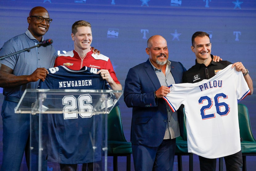 Pro Football Hall of Famer Demarcus Ware poses with IndyCar driver Josef Newgarden with a...