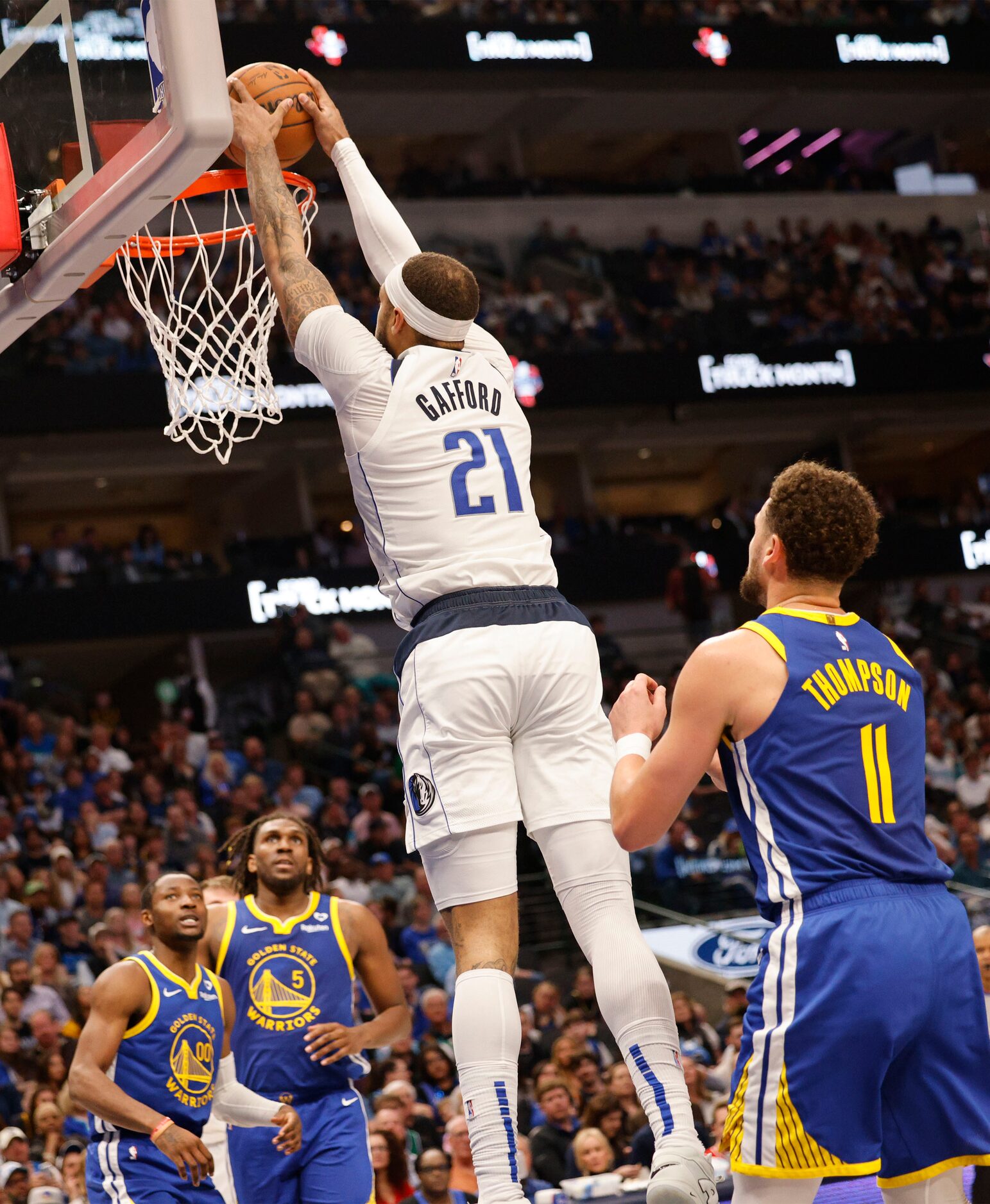 Dallas Mavericks center Daniel Gafford (21) dunks during the second half of an NBA...