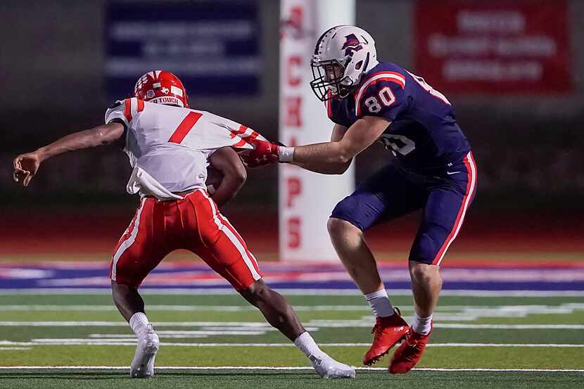 Aubrey defensive lineman Jett Runion (80) drags down Terrell’s Kanye Nix (1) during the...