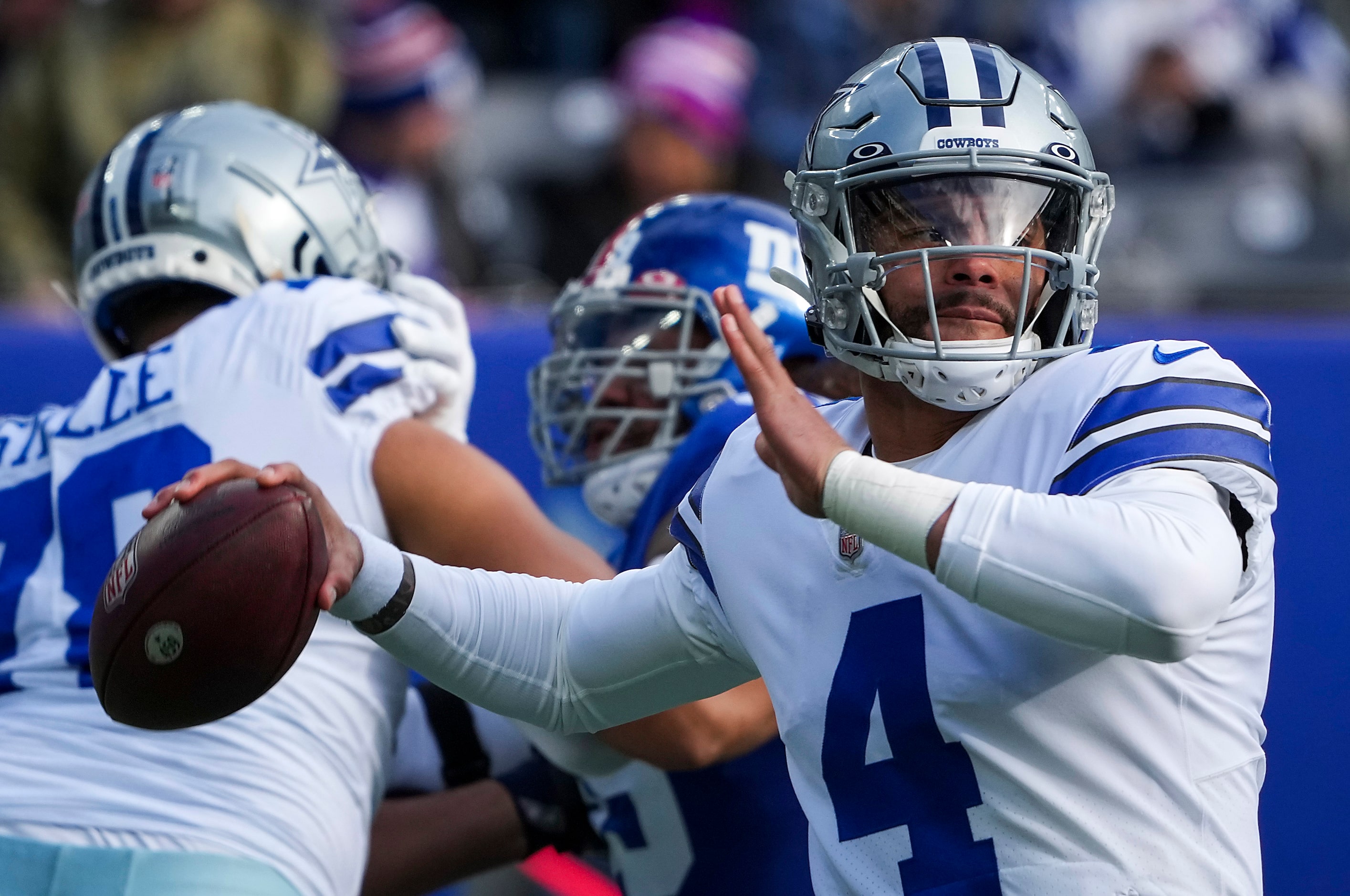 Dallas Cowboys quarterback Dak Prescott (4) throws a pass during the first half of an NFL...