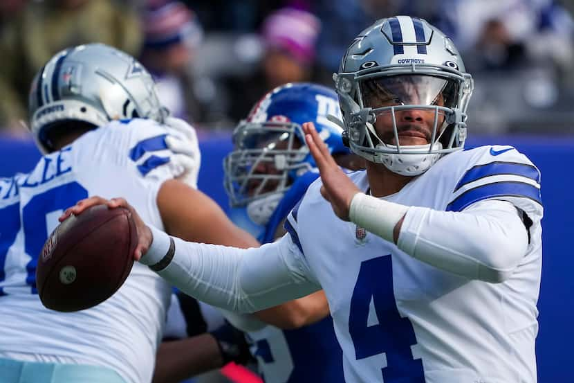 Dallas Cowboys quarterback Dak Prescott (4) throws a pass during the first half of an NFL...