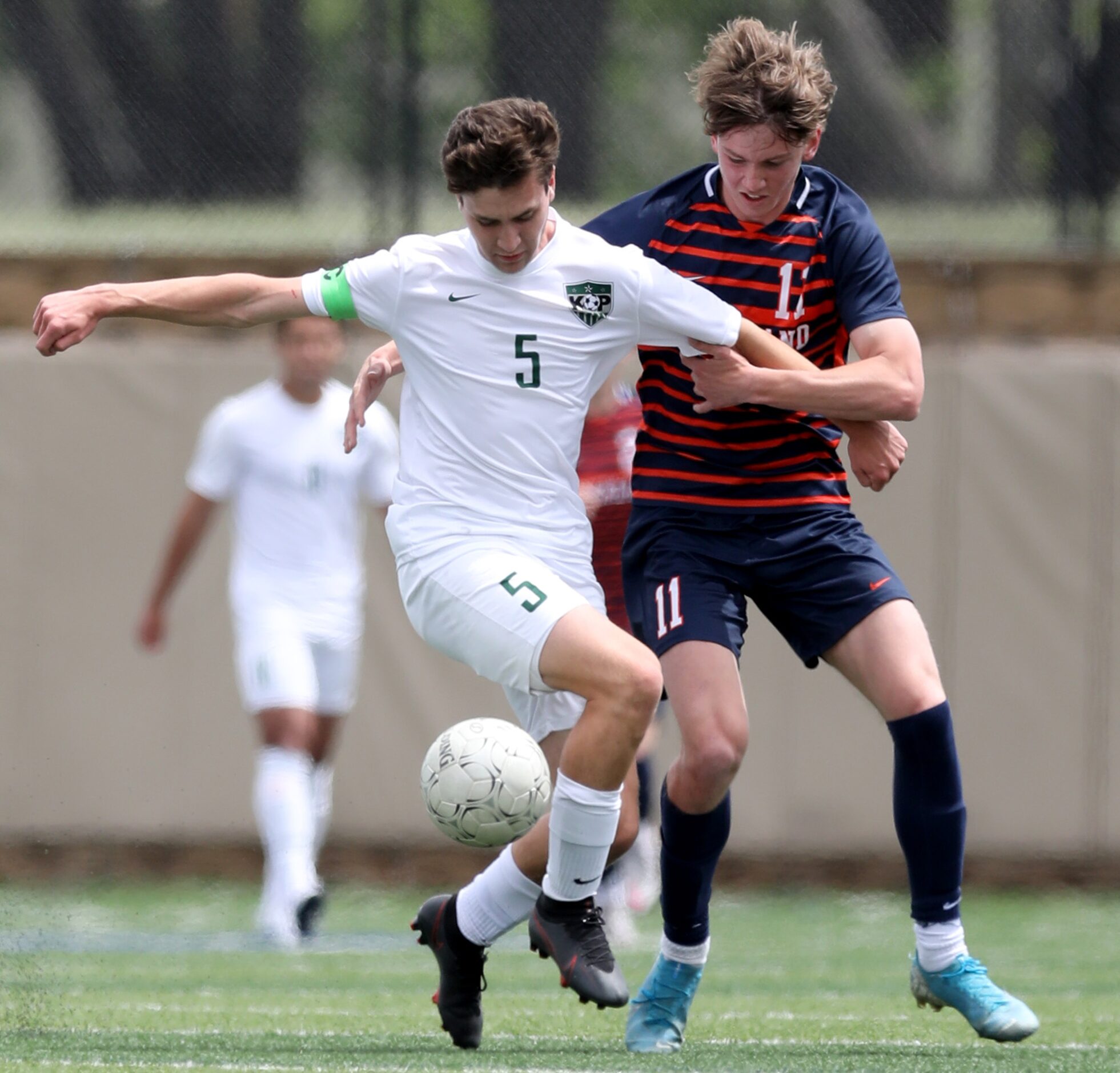 Frisco Wakeland's William Heidman (11) and Humble Kingwood Park's Brandon Rogers (5)...