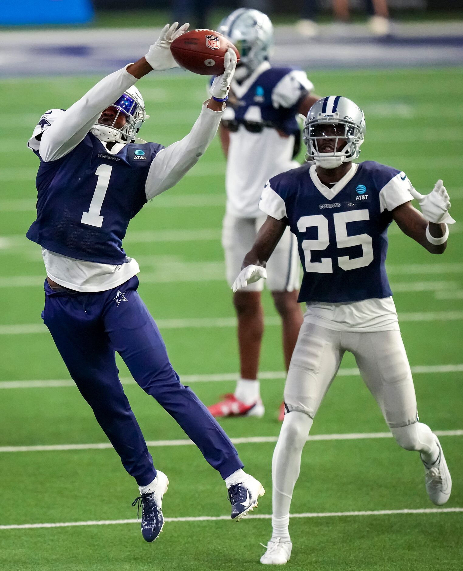 Dallas Cowboys cornerback Kelvin Joseph (1) catches a pass in front of cornerback Nahshon...