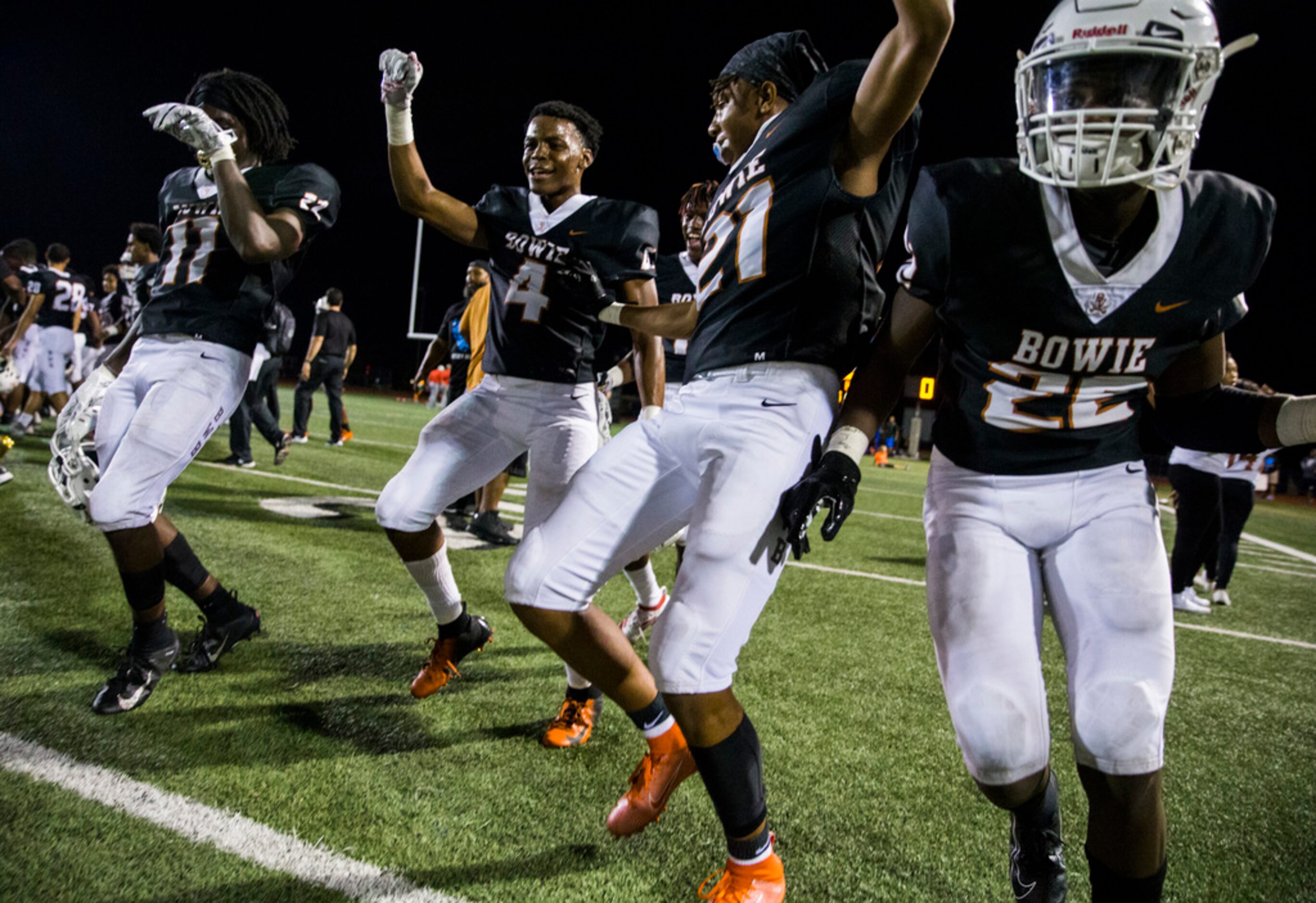 Arlington Bowie football players celebrate after a 28-14 win over Flower Mound Marcus on...