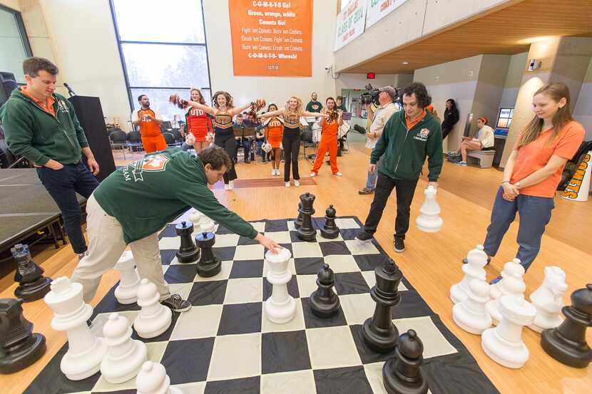 Members of the UTD chess team  play a game on an oversized board at a March 24 pep rally in...