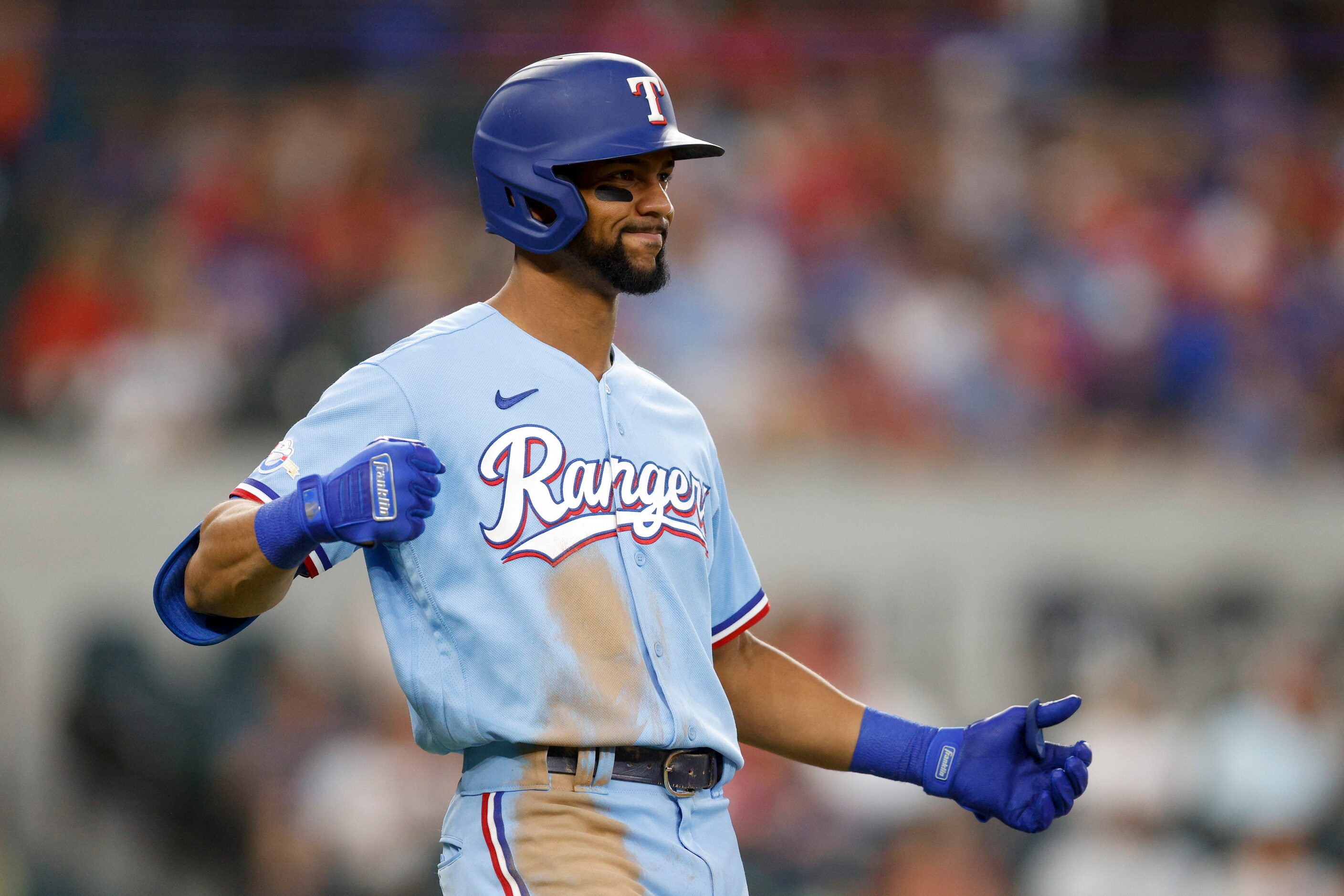 Texas Rangers center fielder Leody Taveras (3) reacts after flying out to right field during...